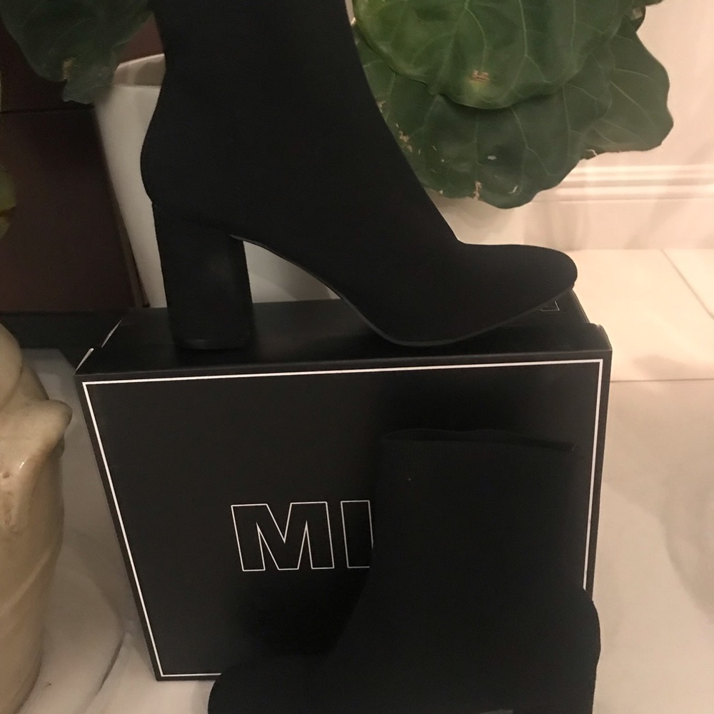Black ankle stretch knit boot by Mia. 8.5 medium.